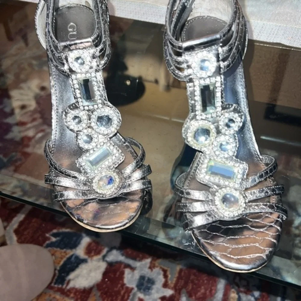 Guess heels about to 4inches, big rhinestones , bright and shiny